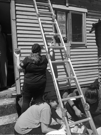 Volunteers collaborating on a building renovation